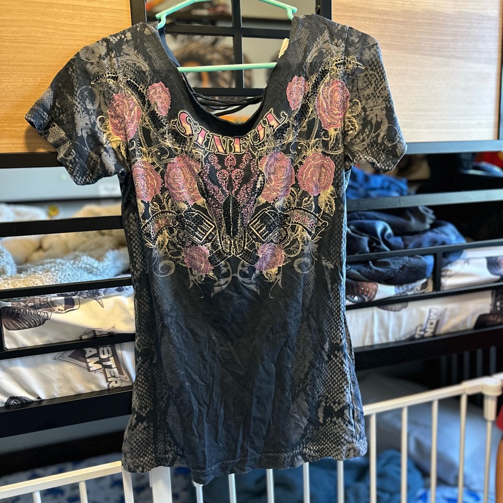 Sinful woman’s shirt